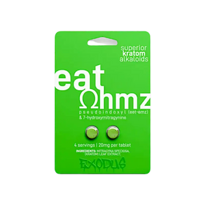 A green blister pack containing two tablets labeled ’eat ohmz’ with kratom alkaloids.