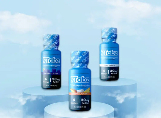 Three blue bottles of Fitobz supplements against a cloudy backdrop.