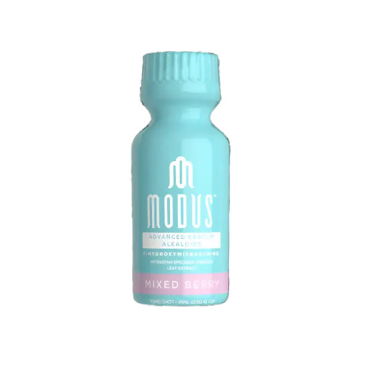 Light blue bottle with ’Modus’ branding and ’Mixed Berry’ flavor text.