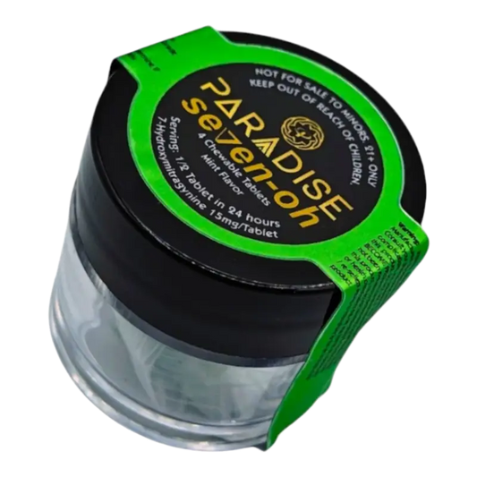 Clear glass jar with black lid and green accent band labeled ’Paradise Seeds’