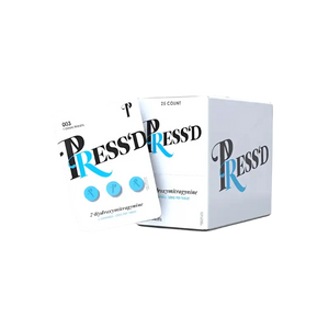 White product packaging with ’PRESSD’ text in black and blue typography.