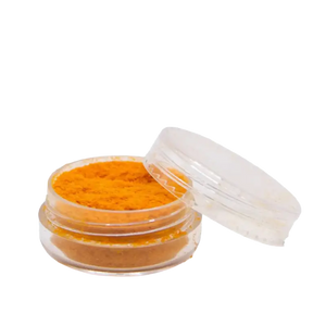 Open jar of orange powder.
